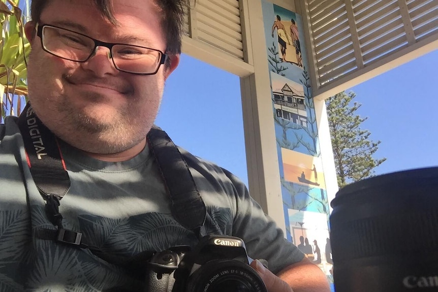 Tim Morrissey runs a photography business and advocates for people with a disability.