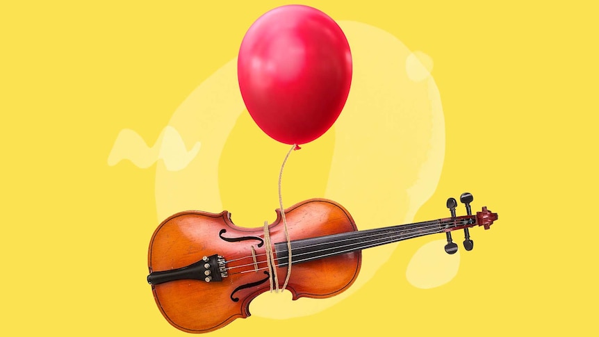 A red balloon is tied around a violin lying on its side. Both float on a bright yellow background.