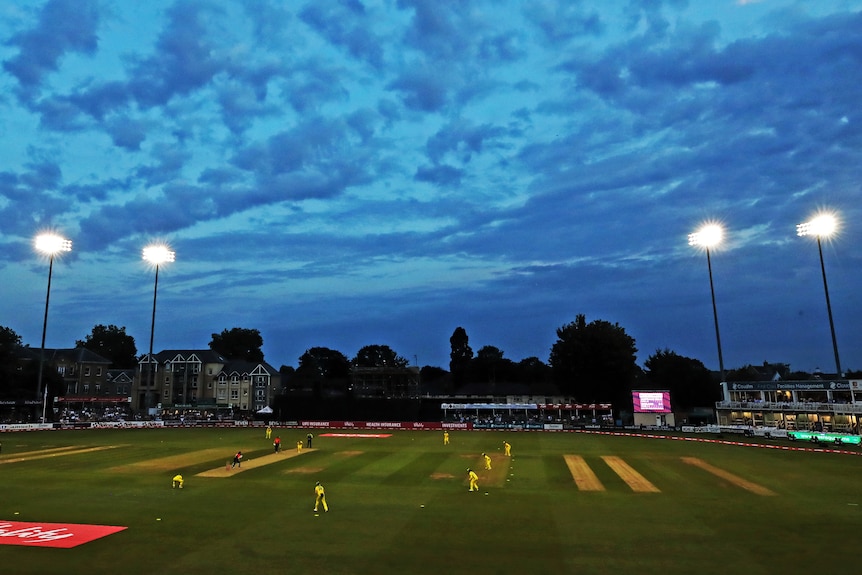 A wide shot of a cricket ground with a match being played between Australia and England.