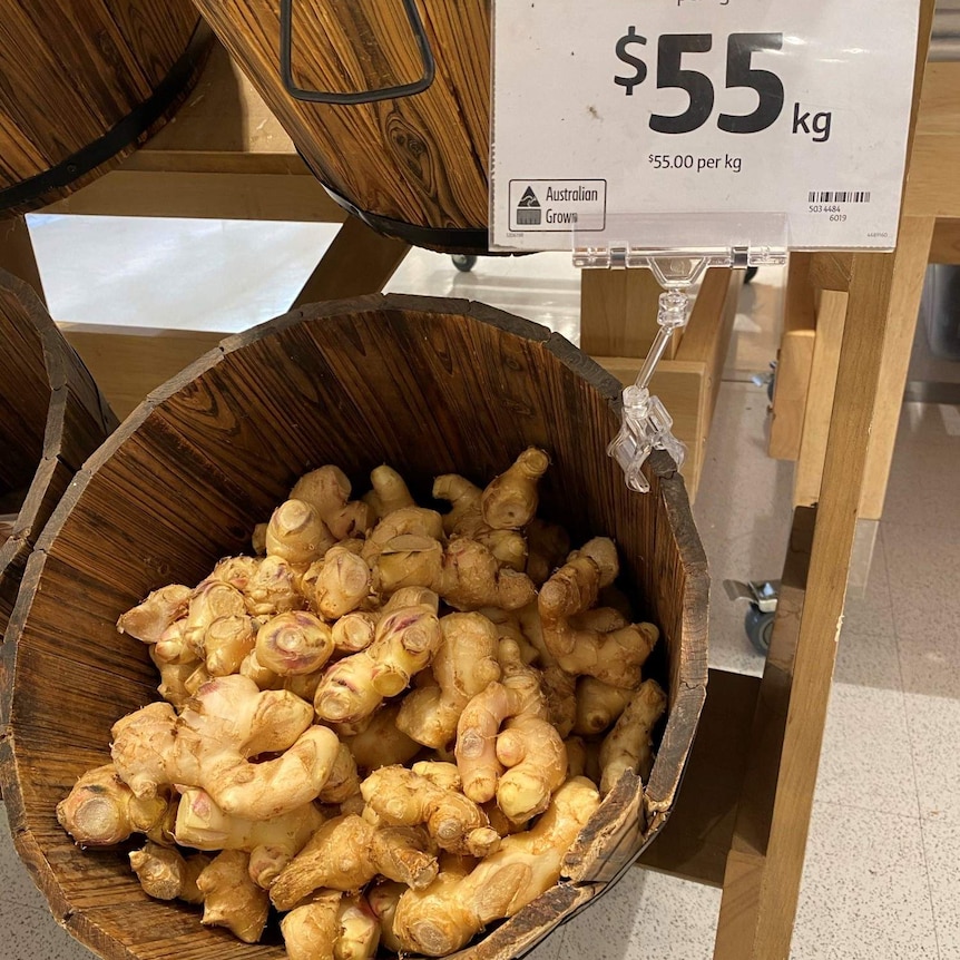 A bucket of ginger with a price of $55 a kilo in a supermarket