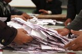 Egyptian officials count ballots after constitution poll