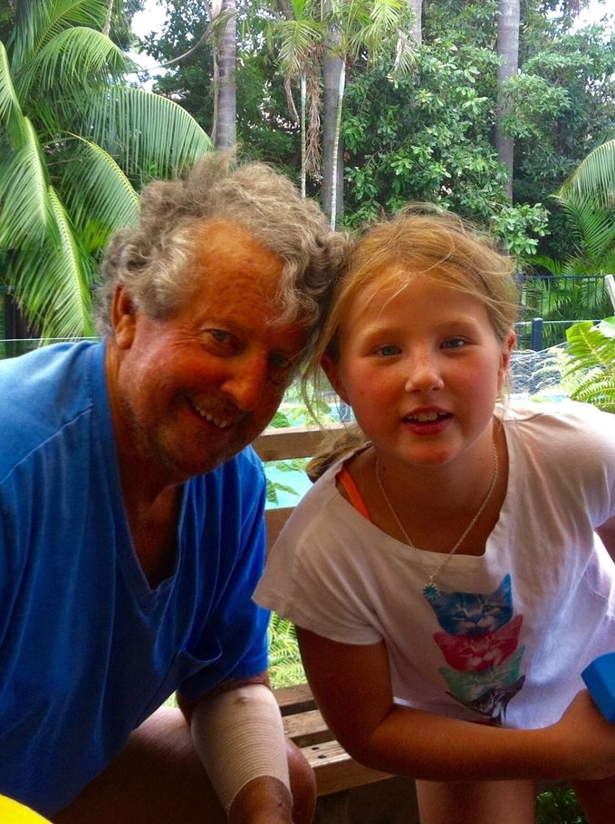 Man with young girl in backyard