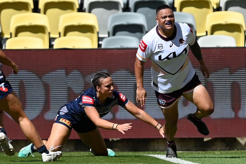 Mele Hufanga of the Brisbane Broncos runs after an NRLW try against the North Queensland Cowboys.