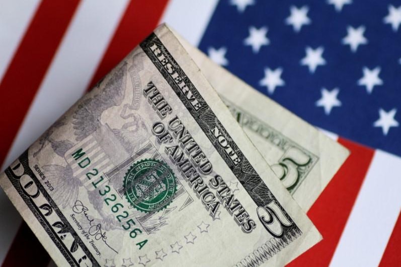 $US5 note and US flag