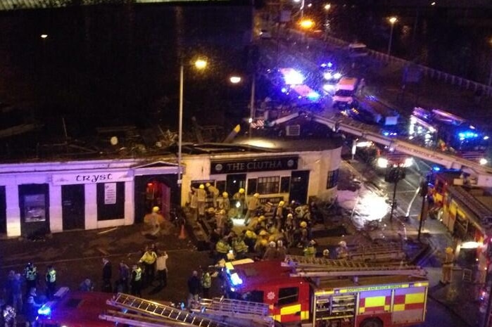 A helicopter crashes into a pub in Glasgow as firefighters surround the area