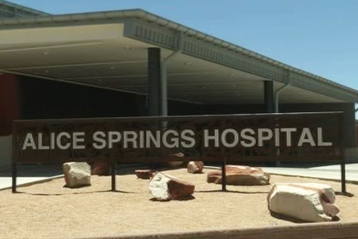 Exterior shot of Alice Springs hospital with the name in big letters out the front.
