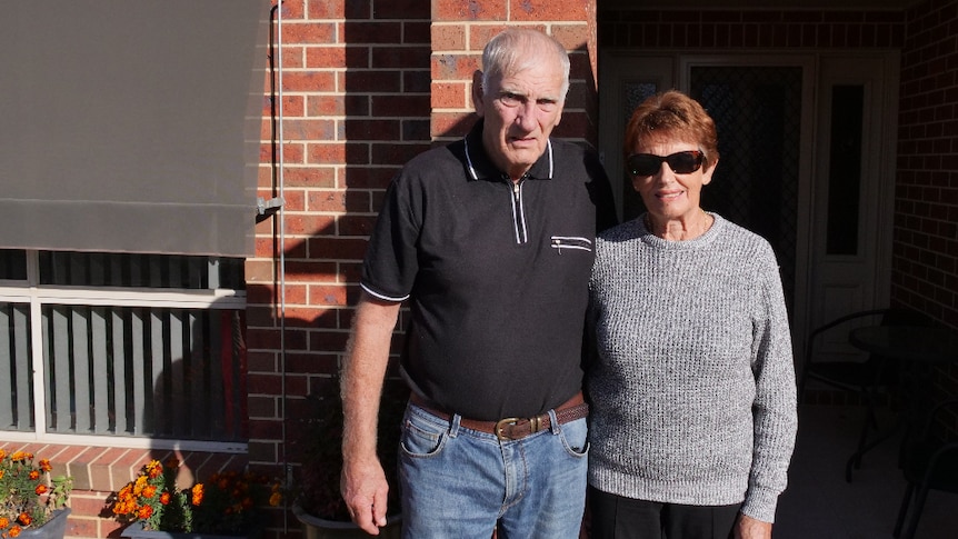 Albury couple Gwen and Bill Houlihan standing out the front of their home.