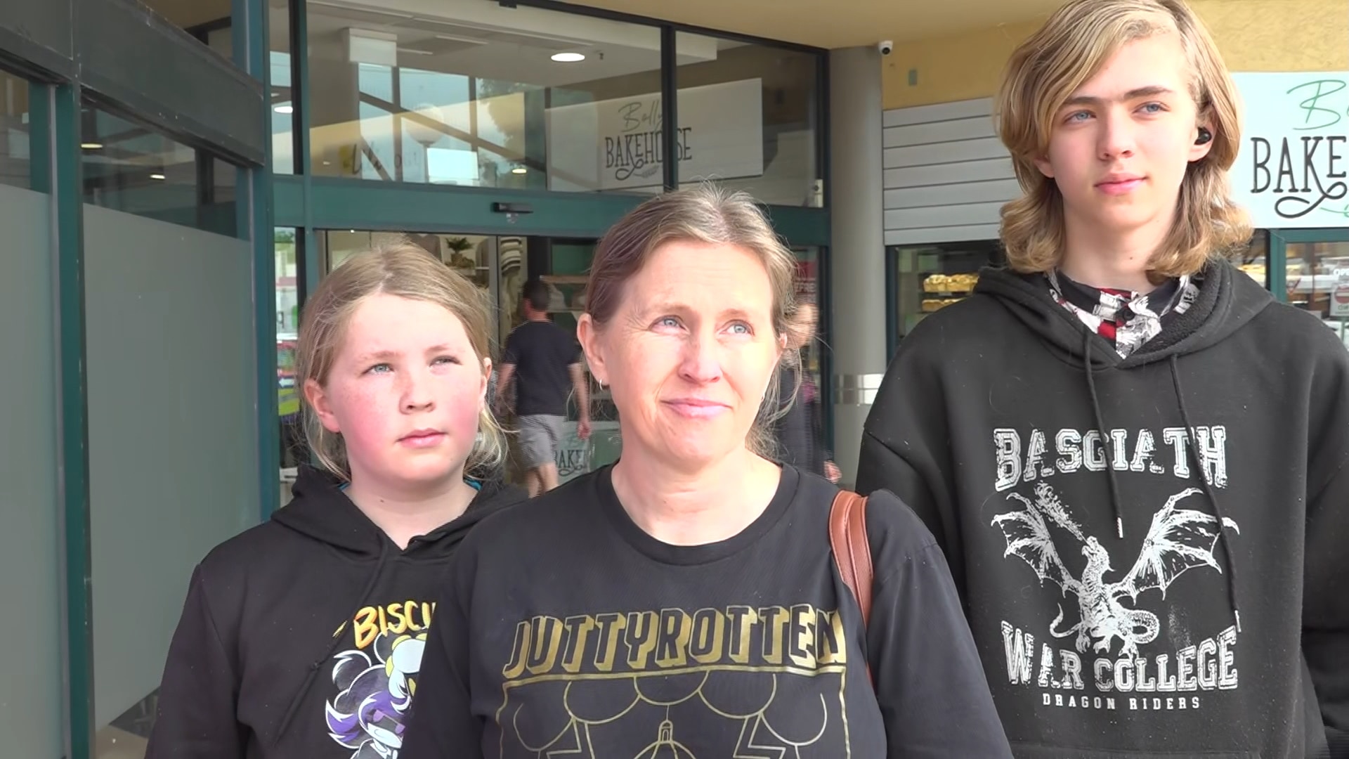 April Shortis pictured outside some shops with her son and daughter in Horsham.