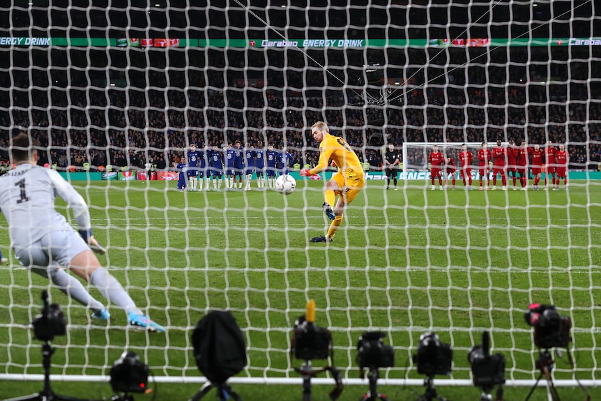 A view from behind the goal as Liverpool goalkeeper Caoimhin Kelleher kicks the ball past Chelsea's Kepa Arrizabalaga.