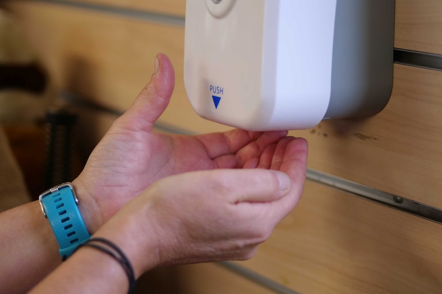 Someone put their hands under an automatic sanitiser dispenser.