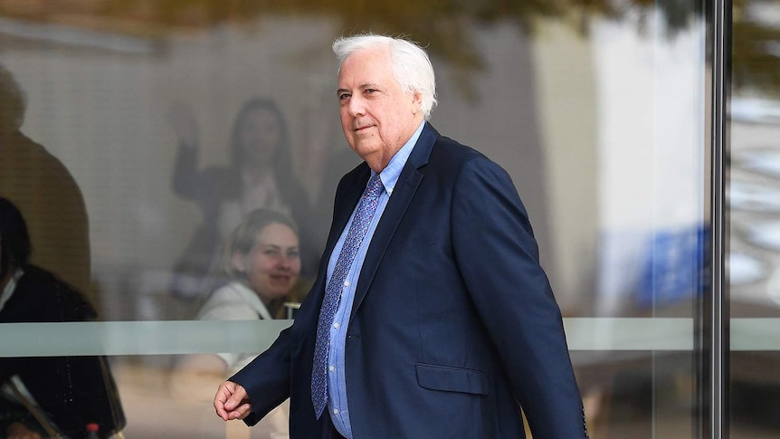 Businessman and former federal MP Clive Palmer arrives at the Supreme Court in Brisbane on August 3, 2017.