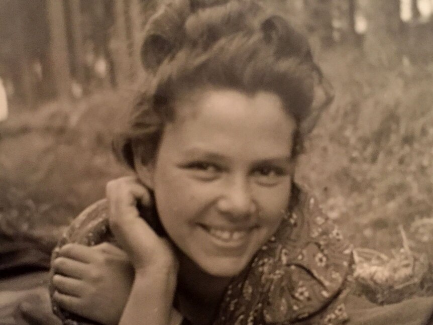 Bella Hirshorn, as a young woman, smiling in a field.