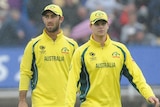 Steve Smith leads Australia off the park as rain falls during the Champions Trophy clash with England
