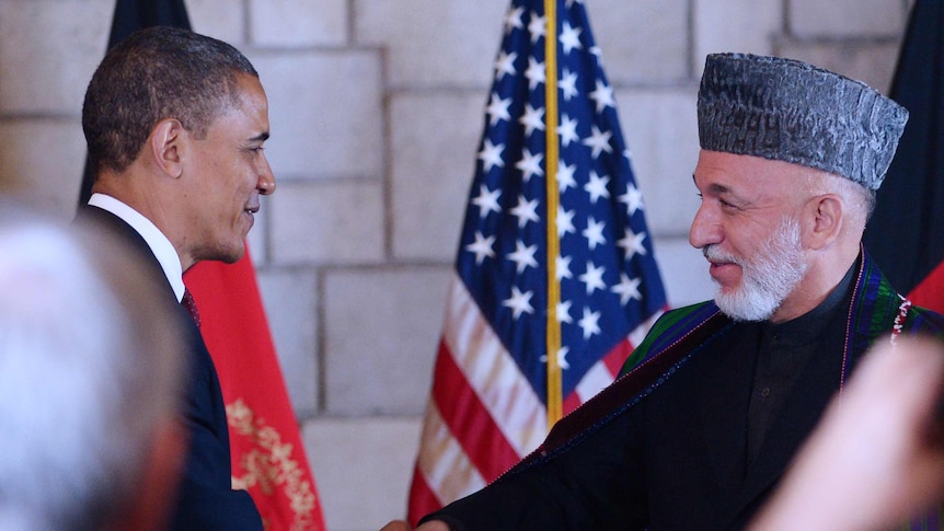 Obama, Karzai shake hands in Kabul