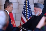 Obama, Karzai shake hands in Kabul