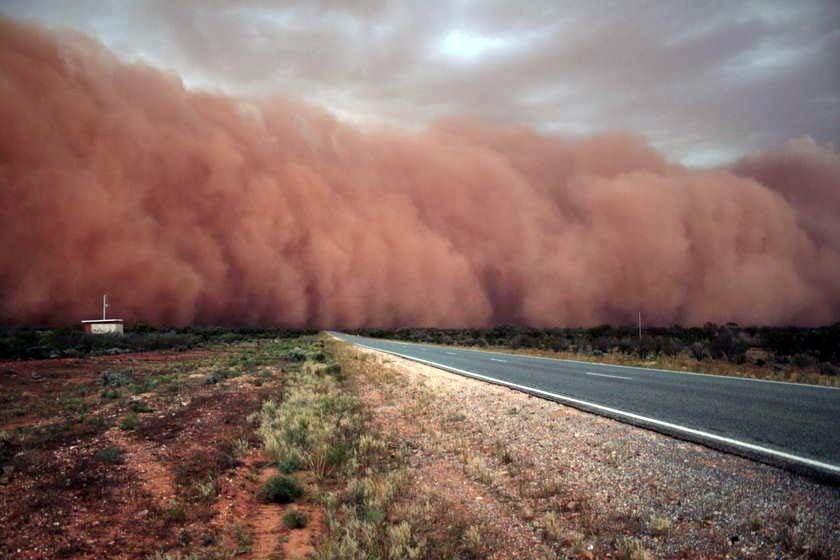 A cloud of dust gathers on the horizon near the Barrier Highway, about 100km east of Broken Hill, NSW.