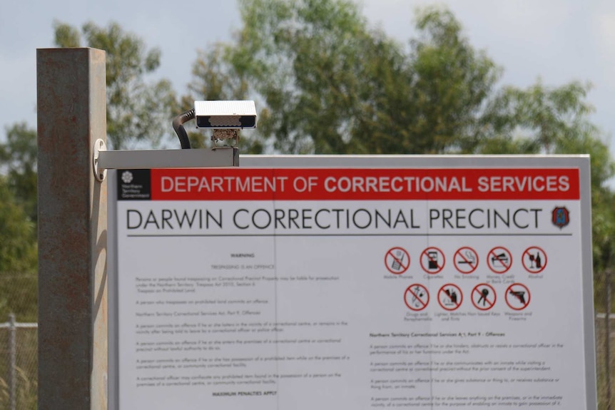 Sign and security lighting at the entrance of the Darwin Correction Precinct, in Holtze.