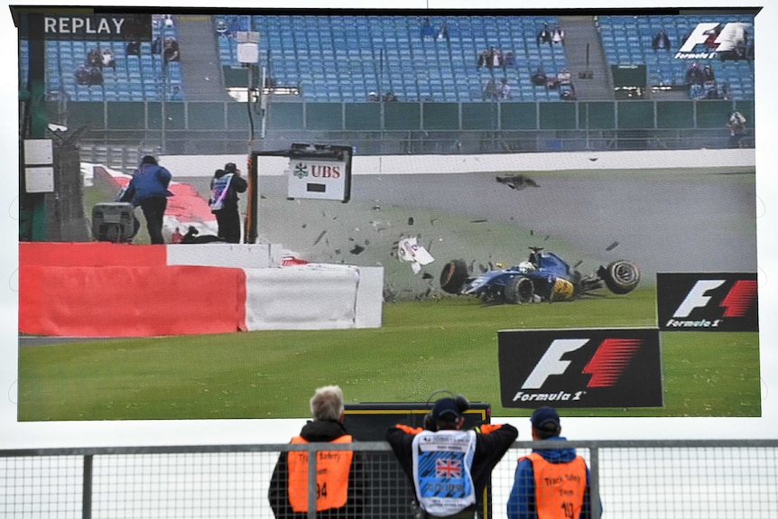 Stewards watch Marcus Ericsson's crash on the big screen