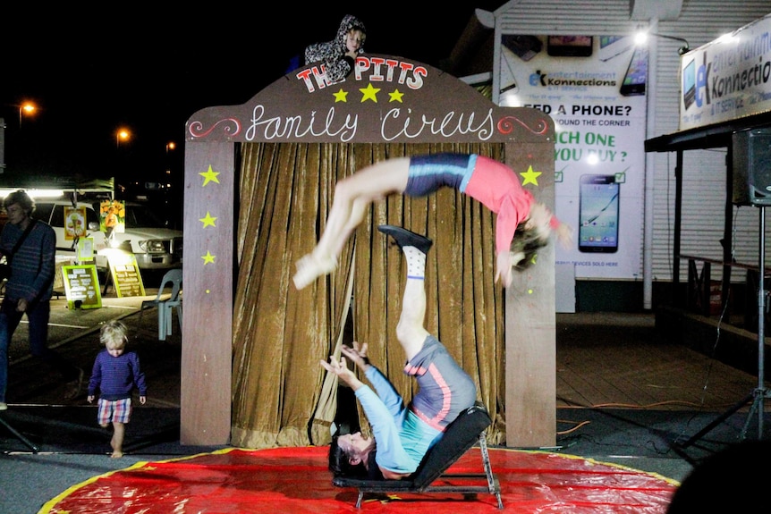 Acrobatic flip during the Pitts Family Circus