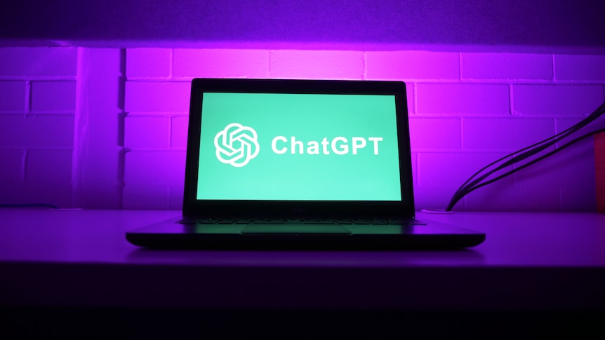 Laptop on desk with chatGPT displayed on screen