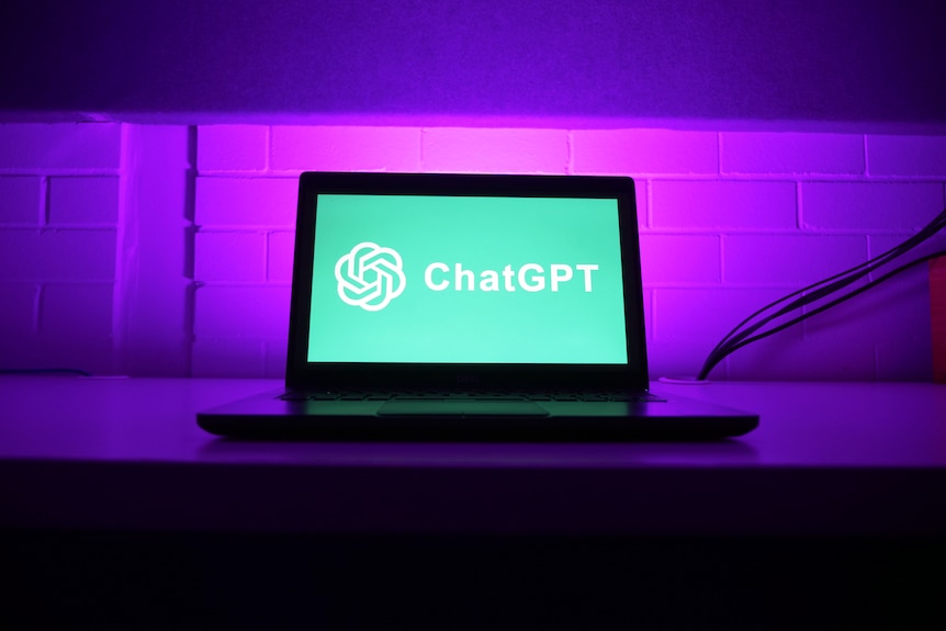 Laptop on desk with chatGPT displayed on screen