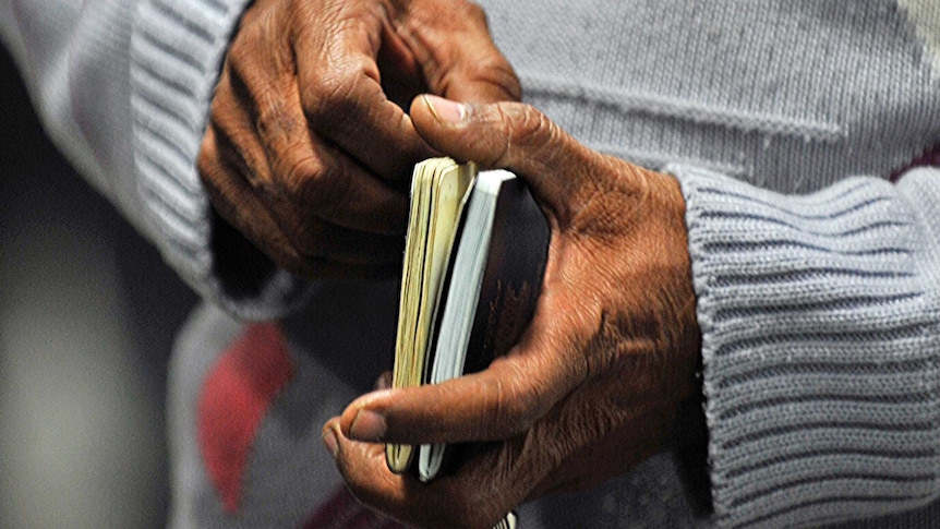 A man holds two passports