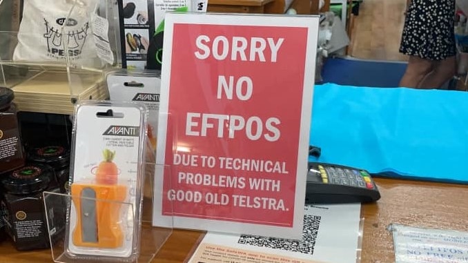 a sign on a checkout desk says 'no eftpos due to technical problems with good old Telstra'