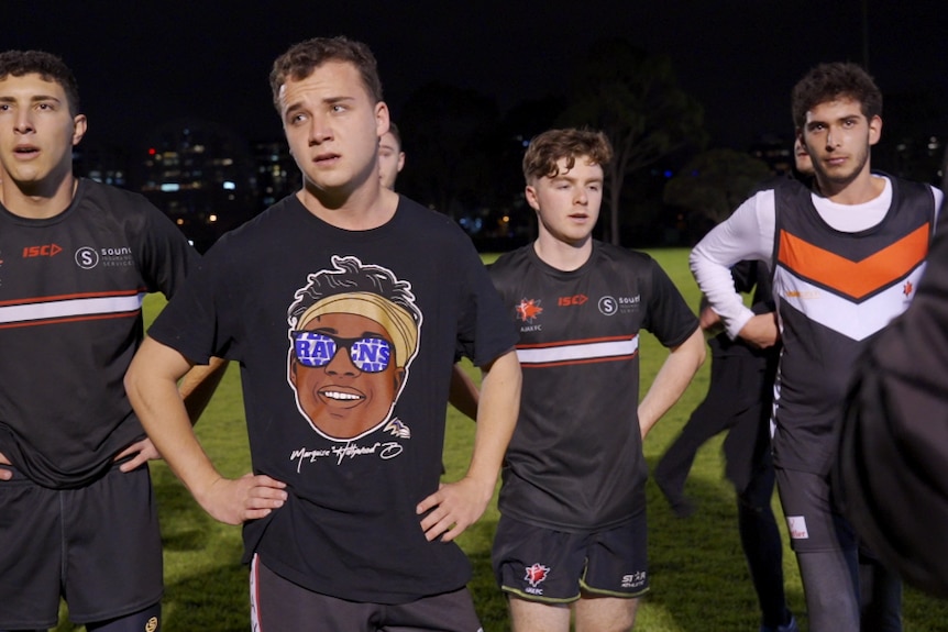 Players at the AJAX Football Club in Melbourne rest during training.