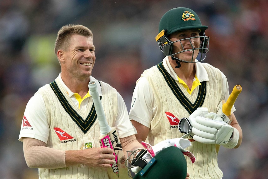 Australia batsmen David Warner and Marnus Labuschagne smile as they walk off the field during the third Ashes Test at Headingley