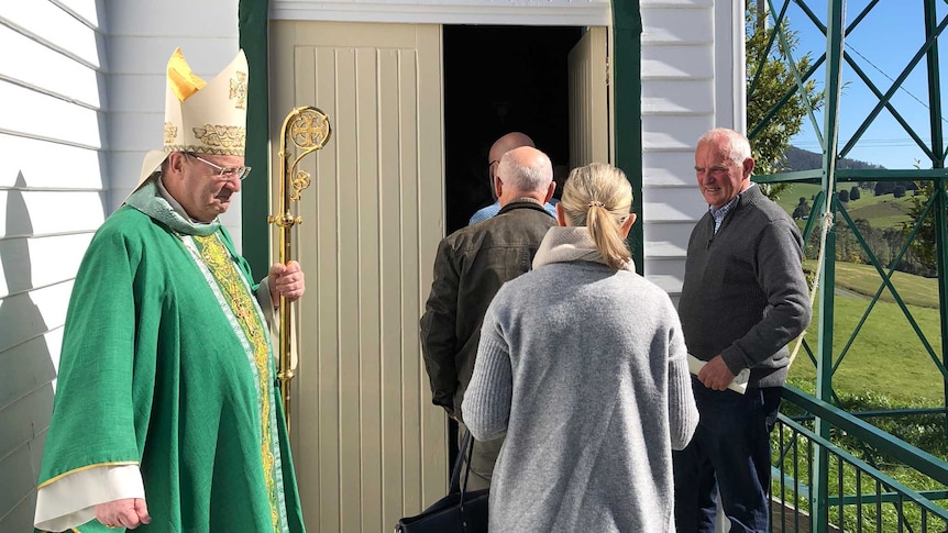 Tasmania's Catholic Archbishop Julian Porteous welcoming people to the church