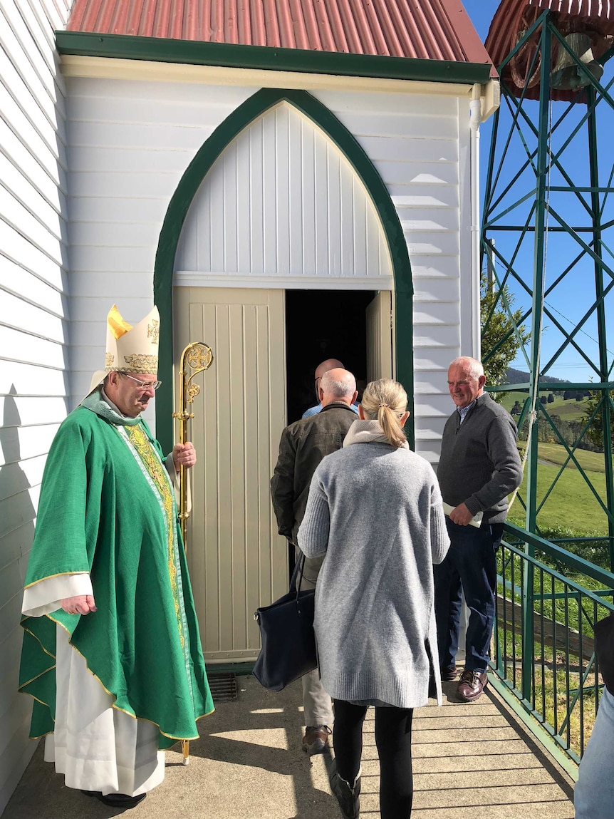 Tasmania's Catholic Archbishop Julian Porteous welcoming people to the church