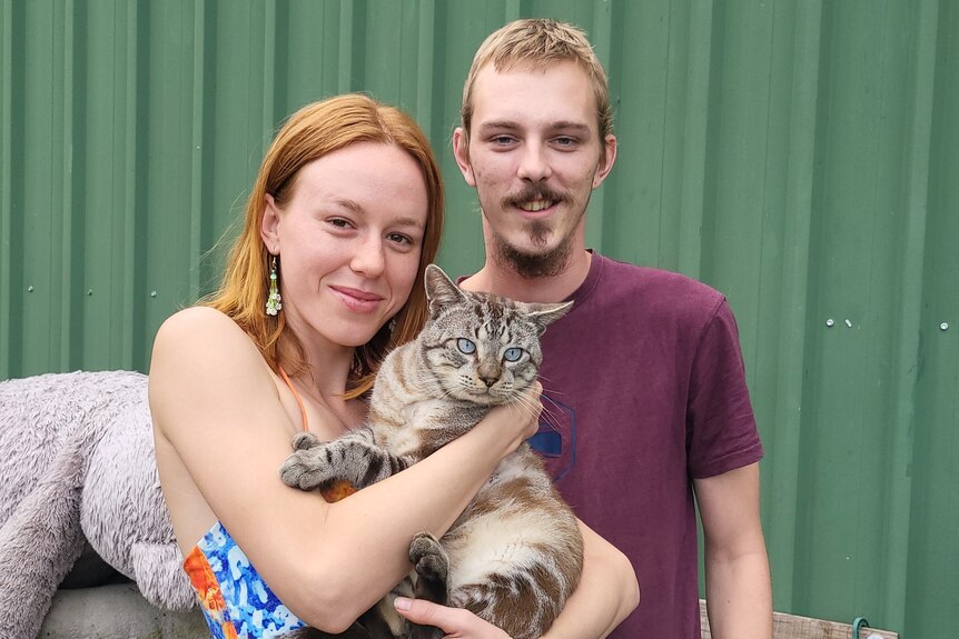 Mikaela Colquhoun and Cooper Morgenstern with their cat Sir Puddin Stacks