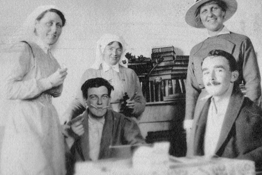 Ida Greaves, matron of the Australian Voluntary Hospital, with nurses and patients