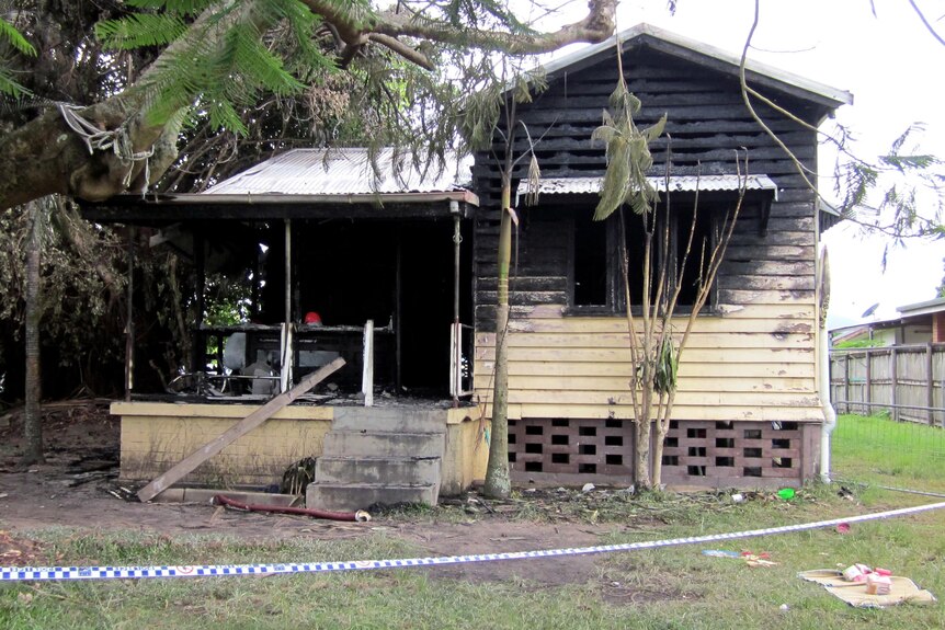 Scorch marks cover a house in Manoora, Cairns, after it was destroyed by fire.