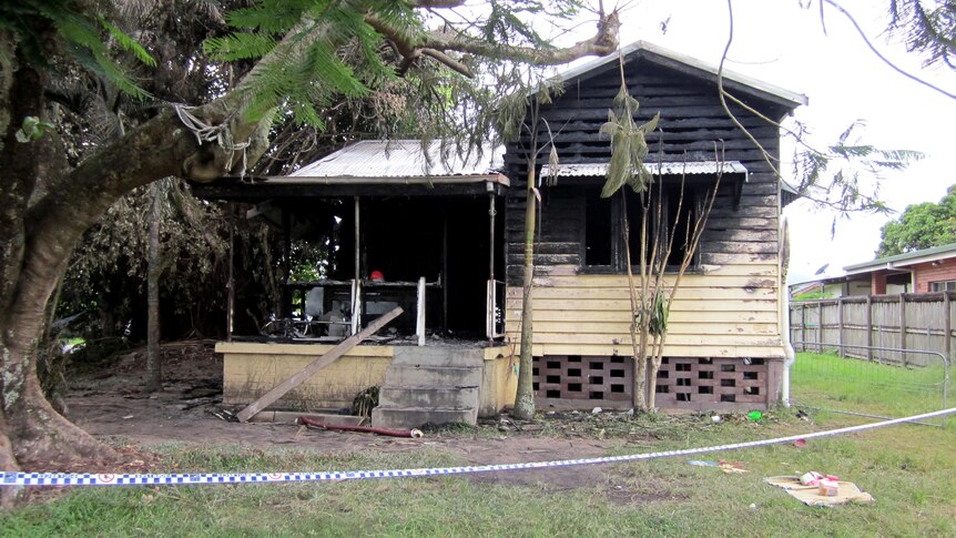 Scorch marks cover a house in Manoora, Cairns, after it was destroyed by fire.