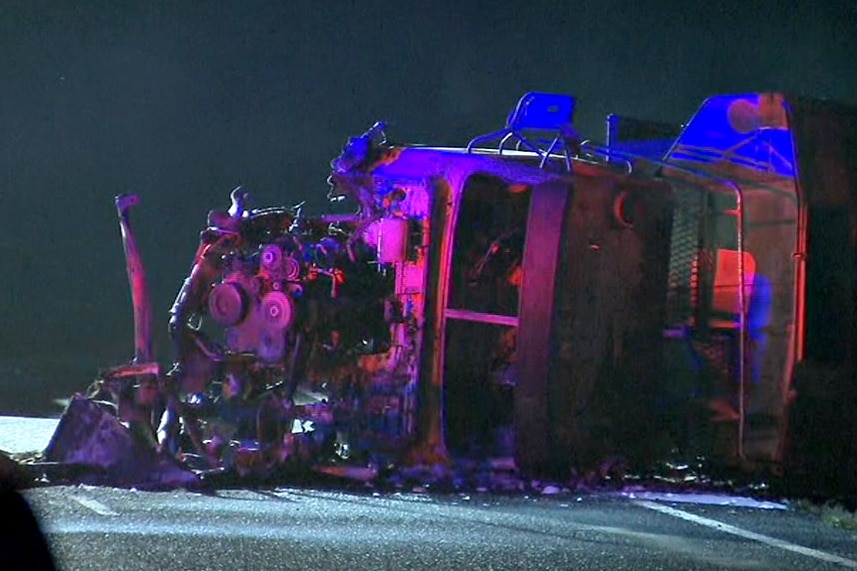 A truck lays on its side after a head on crash with a car which killed a mother and four children near Kingaroy.