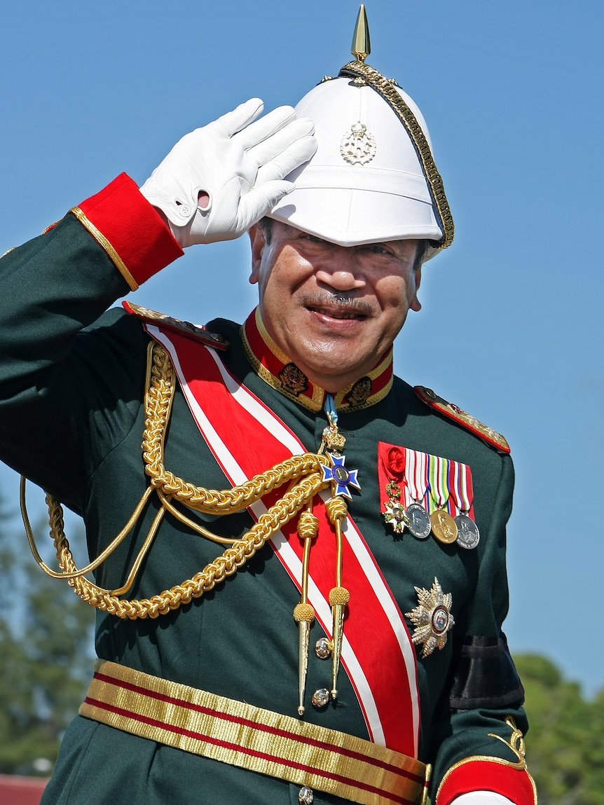 Tonga's king George Tupou saltues - file photo