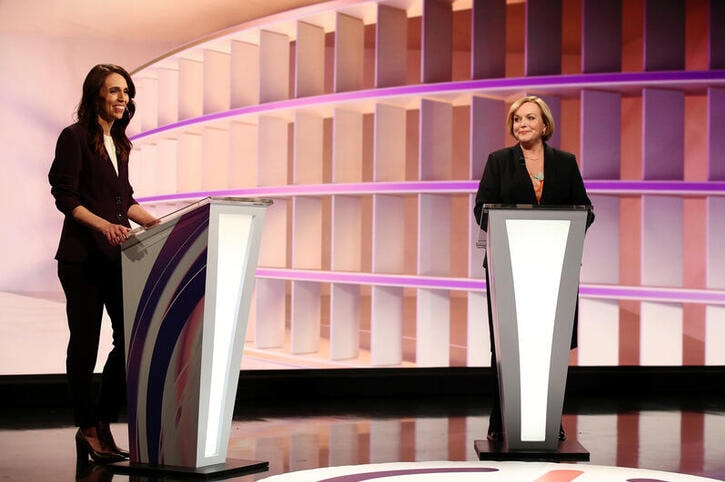 New Zealand Prime Minister Jacinda Ardern (L) and National leader Judith Collins participate in a televised debate.