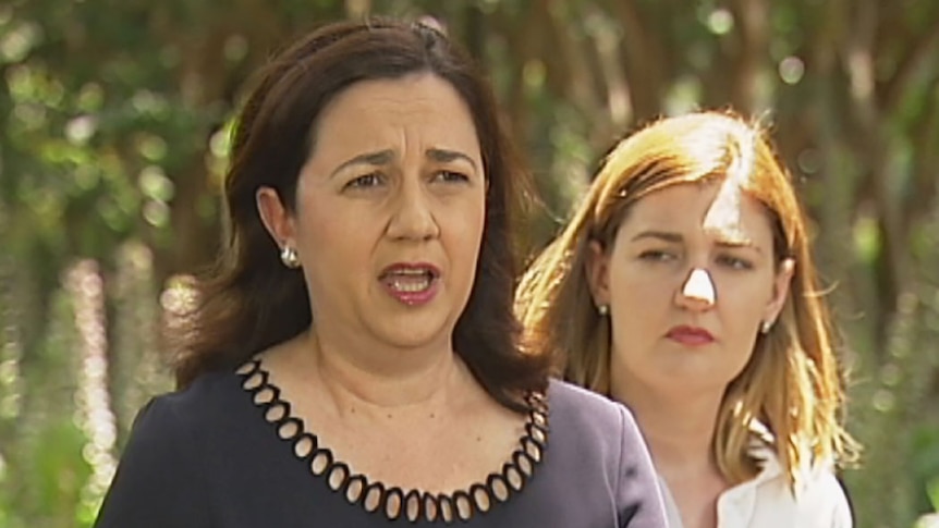 Queensland Premier Annastacia Palaszczuk speaking to media, with Minister for Women Shannon Fentiman behind her