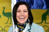 Anna Meares smiles with the Australian flag