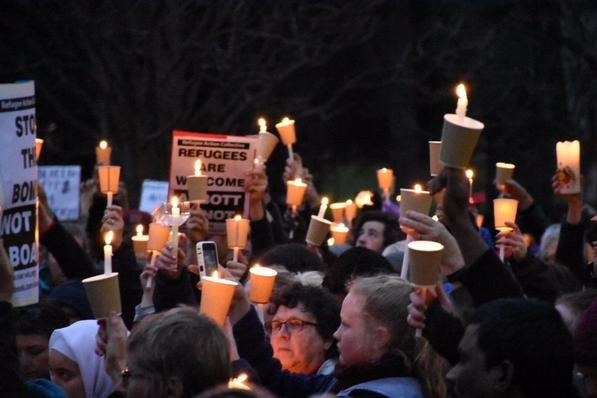 Crowds gather at Melbourne's Treasury Gardens for a candlelit vigil to show support to Syrian asylum-seekers, September 7, 2015.