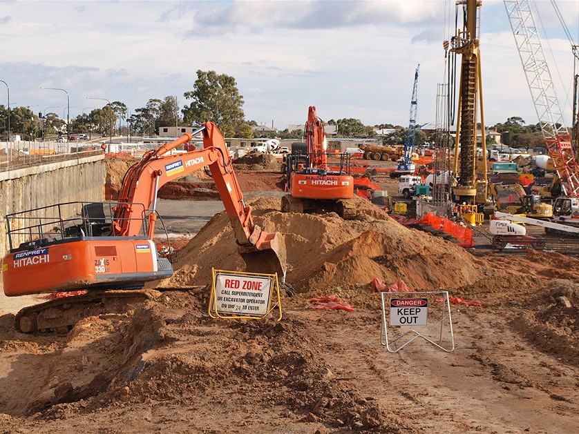 Digging machinery at work in the mud