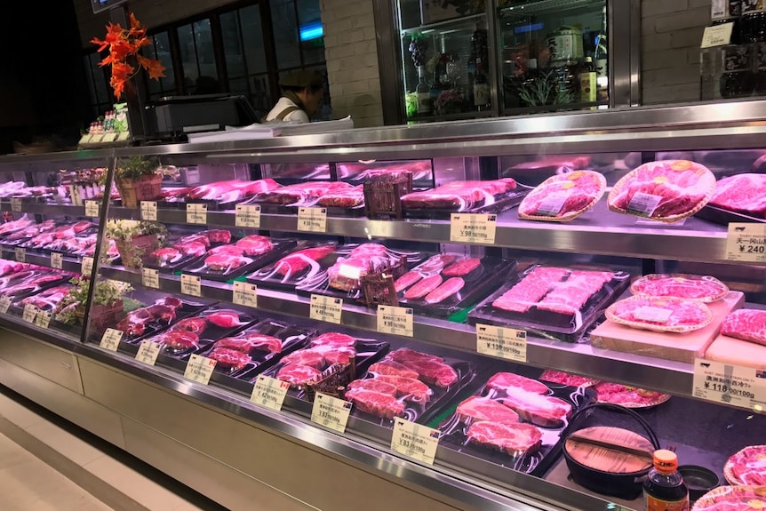 Meat in a butcher's window with Chinese labels