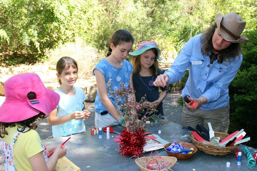 Children enjoy a craft activity at the Australian National Botanic Gardens.