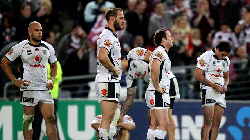 Dejected Warriors players after losing NRL grand final