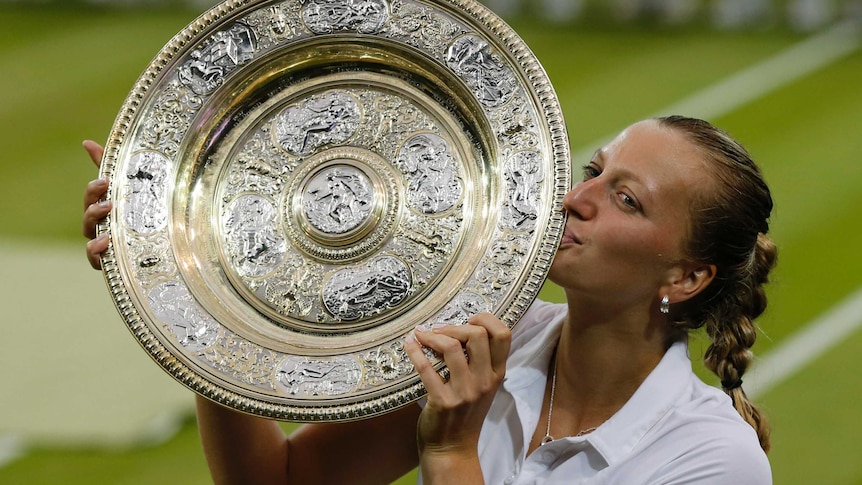 Petra Kvitova kisses Wimbledon trophy