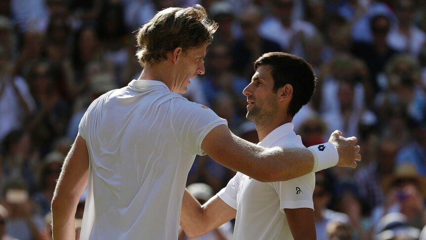 Novak Djokovic (R) meets Kevin Anderson at the net after beating him in the Wimbledon final.