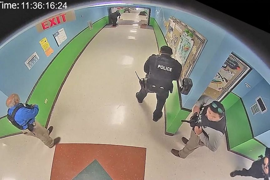Video shows police milling in hallway during Uvalde massacre