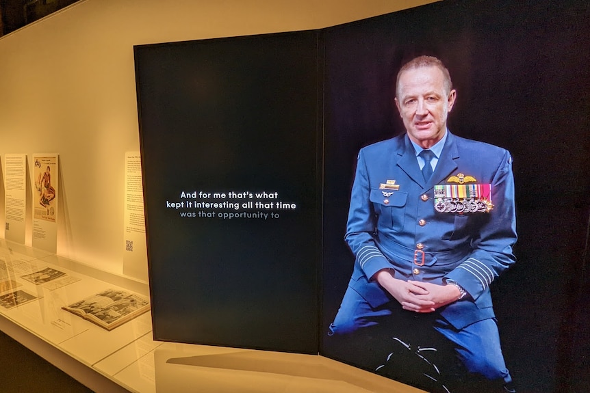 An exhibit featuring the image of a man in military garb