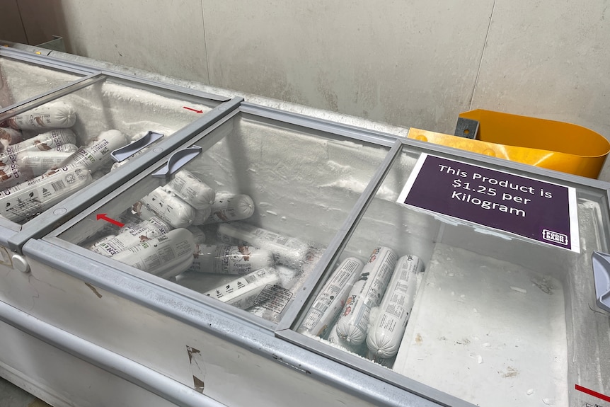 A freezer with tubes of pet meat sausage at Foodbank